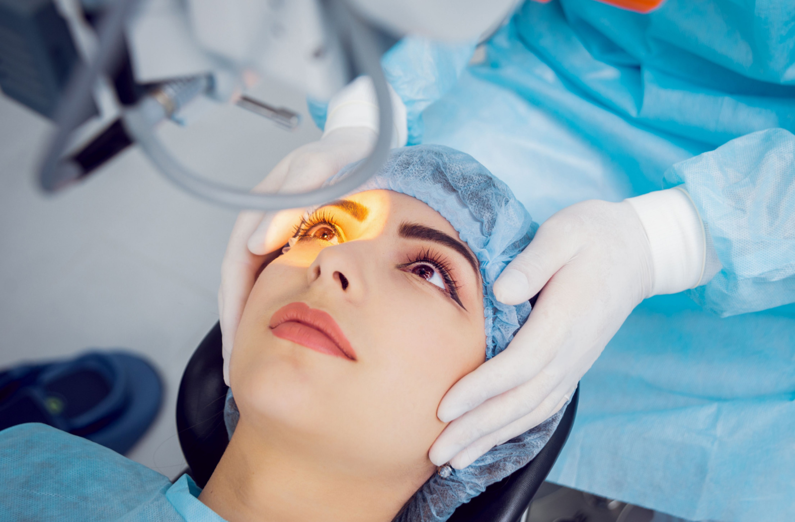 A woman and her eye surgeon preparing for laser eye surgery