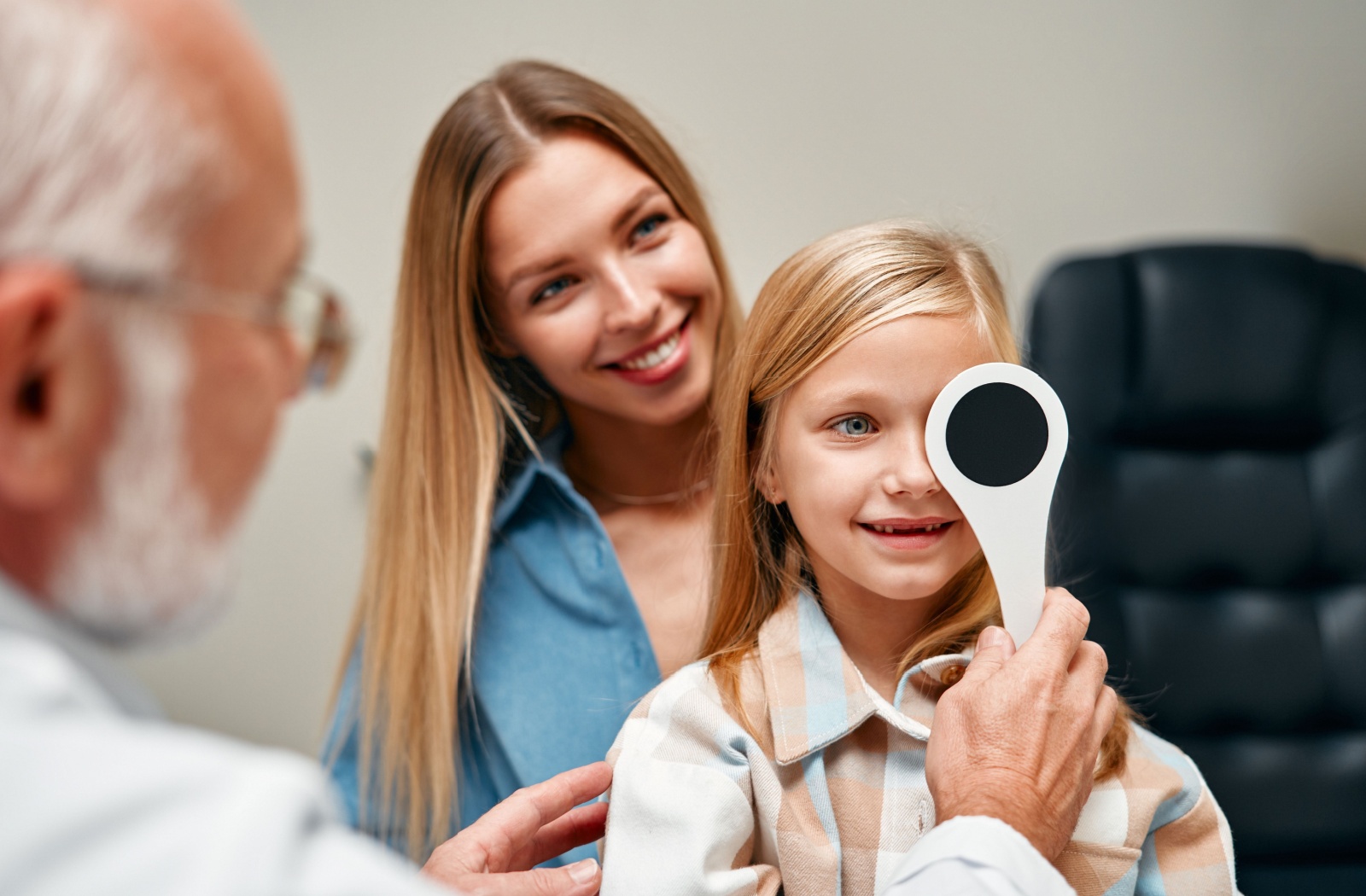 A young child's vision is assessed during their routine eye exam.